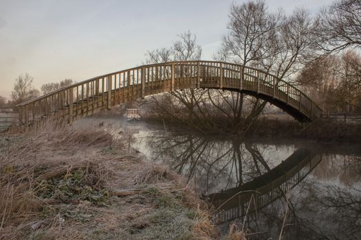 Wooden Footbrige over River Thames on a frosty winters morning near Buscot, Oxfordshire