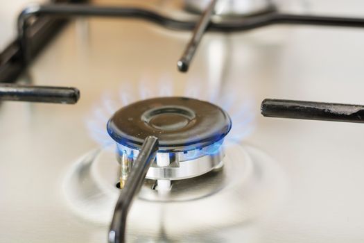 burning gas in range burner of kitchen stove