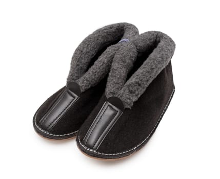 Slippers made of felt and fur in white background
