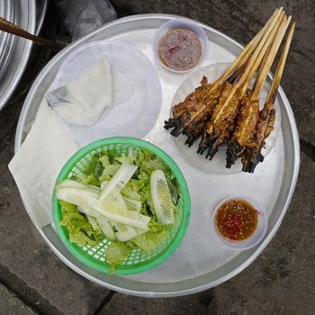 close up of grilled pork skewers in hoi an vietnam