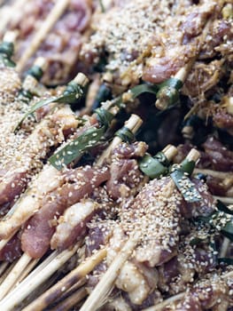 close up of uncooked pork skewers in hoi an vietnam