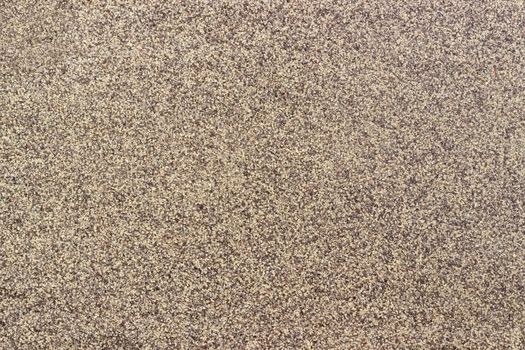 Background of ground black pepper milled coarsely closeup
