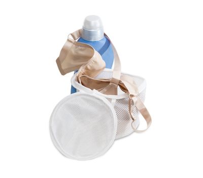 Special laundry bag for washing bras in washing machine against the background blue plastic bottle of a detergent on a light background
