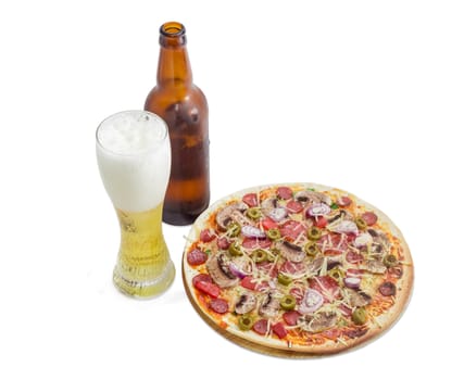 Cooked round pizza with various sausages, button mushrooms and olives, beer glass and bottle with lager beer on a light background
