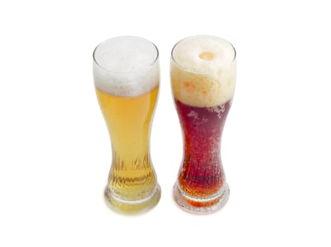 One beer glass lager beer and one beer glass dark beer with foam on a light background
