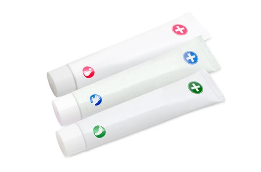 Three white tubes of moisturizer cream for skin care,  cream for hand and cream for feet on a light background
