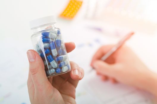 Doctor prescribes pills. pill doctor prescription bottle capsule recipe medicine pharmacist concept