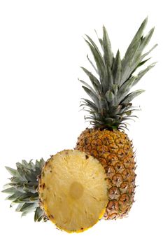 A ripe pineapple on a white background