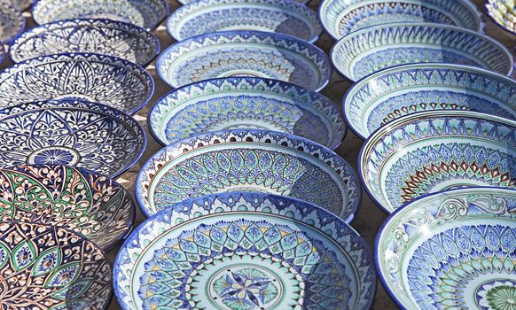 Traditional ceramic dishware in a street market, Uzbekistan