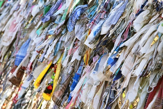 Close up of lots of Buddhist ribbons fluttering in the wind