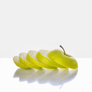 green apple slices and reflexion