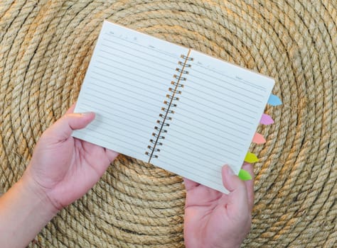 Open Hand Book on a jute rope background