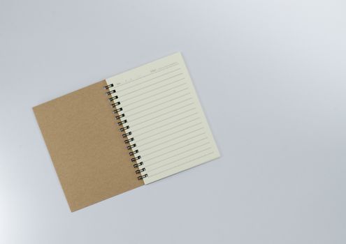 Recycled paper notebook open front cover on white background