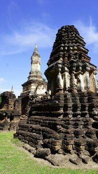 closeup angled view Historical Pagoda Wat chedi seven rows temple in Sukhothai Thailand