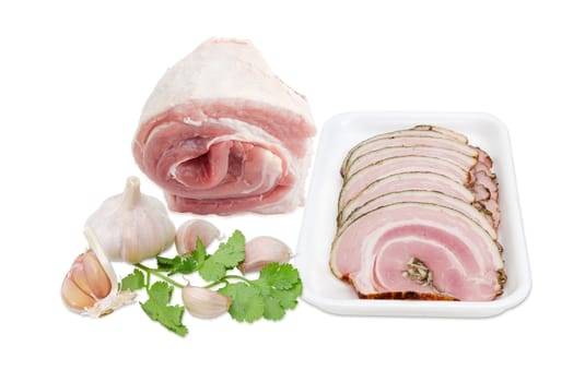 Sliced roll of a baked pork belly on a plastic tray, roll of a uncooked pork belly, garlic and coriander on a light background 

