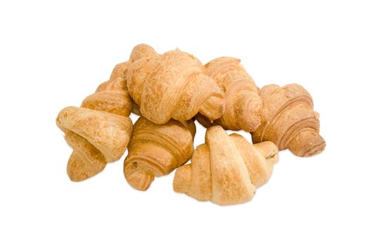 Several baked croissants on a light background
