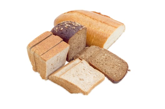 Wheat bread, sliced bread for toasting, partly sliced bread with whole grain of a sunflowers on a light background
