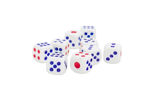 Standard plastic white six-sided dice with with red and blue dots and rounded corners on a light background
