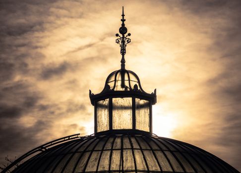 The Top Of A Victorian Eta Glasshouse Against A Winter Sunset Sky In Glasgow, Scotland