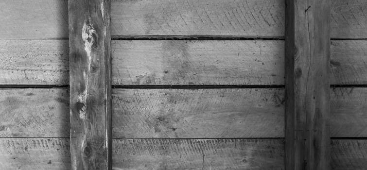 Four wooden boards inside an old outbuilding twobeams and horizontal arrangement