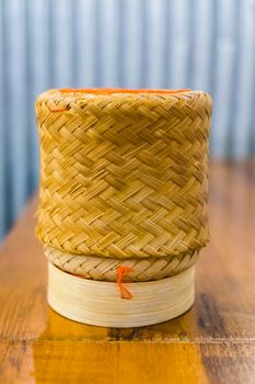 handmade wicker rice on wooden table