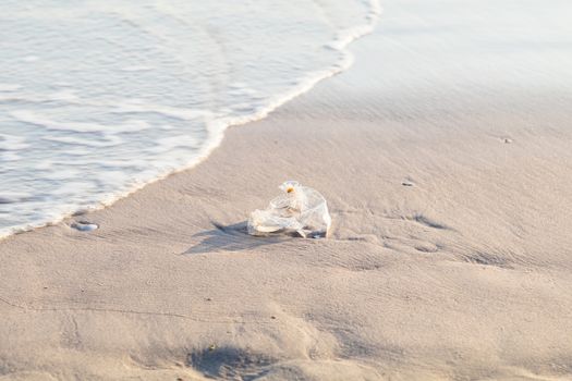 used plastic bag on the beach