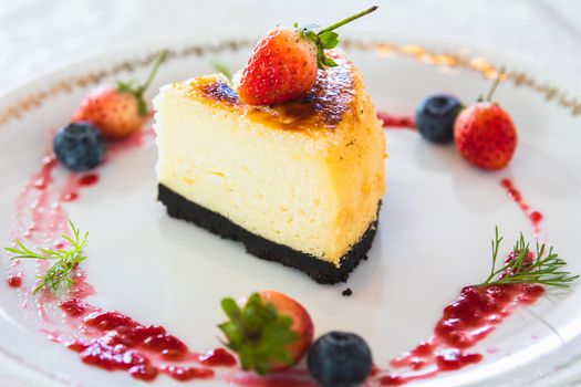 cheesecake with fresh strawberry and blueberry decoration