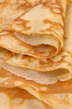 stack of folded crispy fried thin pancake closeup