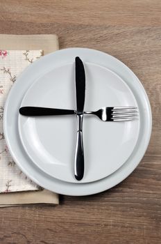 Dining etiquette - I still eat, ready for second plate. Fork and knife signals with location of cutlery set