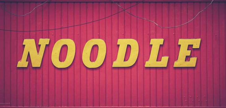 A Grungy Retro Noodle Bar Storefront Sign