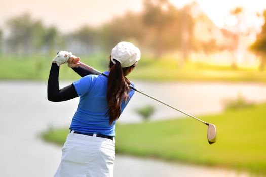 Golfer hitting golf shot on summer vacation, concept go to success.