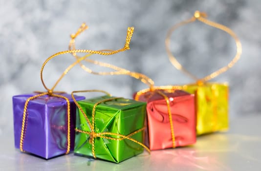 Gift Box And Baubles On Snow With Shiny Background