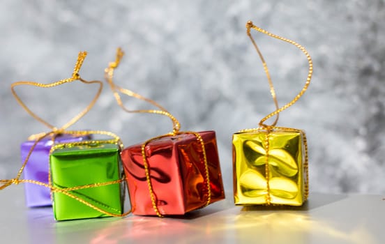 Gift Box And Baubles On Snow With Shiny Background