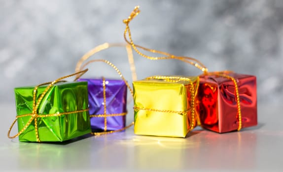 Gift Box And Baubles On Snow With Shiny Background