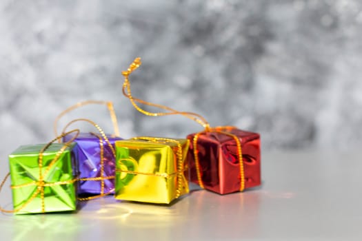 Gift Box And Baubles On Snow With Shiny Background