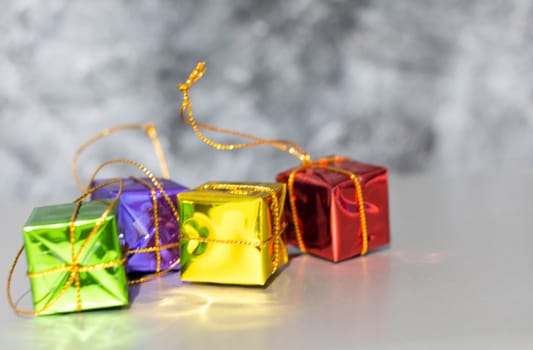 Gift Box And Baubles On Snow With Shiny Background