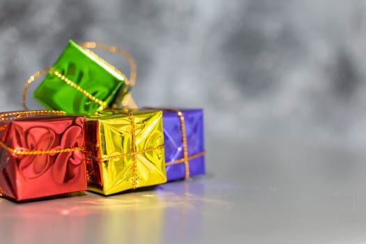 Gift Box And Baubles On Snow With Shiny Background