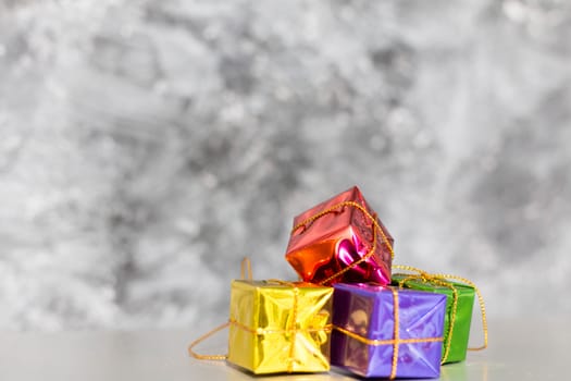 Gift Box And Baubles On Snow With Shiny Background