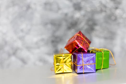 Gift Box And Baubles On Snow With Shiny Background