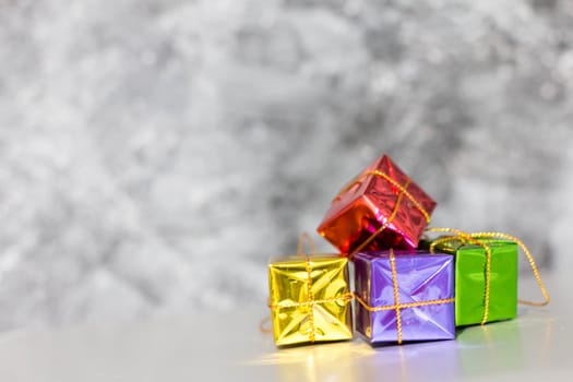 Gift Box And Baubles On Snow With Shiny Background