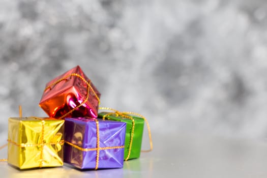 Gift Box And Baubles On Snow With Shiny Background