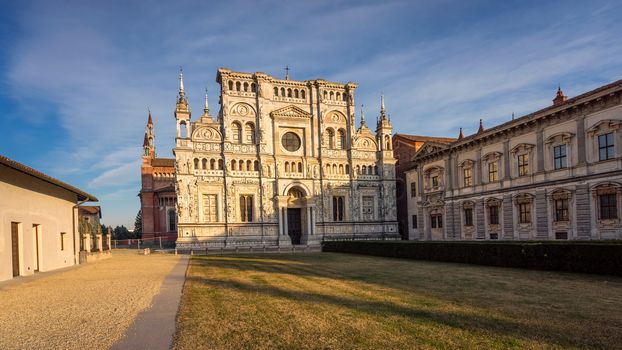 View of the cathedral of Certosa di Pavia Carthusian monastery at sunset.