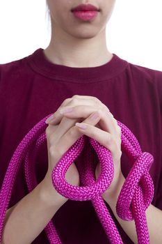 Raspberry rope in female hands on a white background