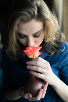 Portrait of a beautiful girl with a rose
