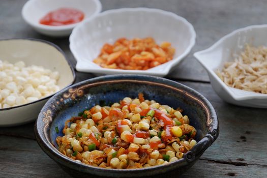 Vietnamese street food, corn fried dried shrimp, is popular snack food make from corn fry with shrimp, butter, scallions, eat with chilli sauce 