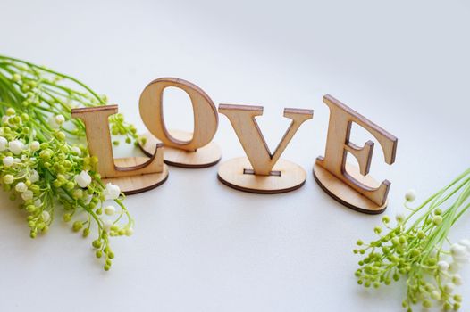 wooden letters love and Lily on the table.