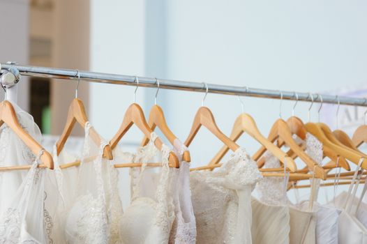 beautiful white bridesmaid dresses hanging on trempel.