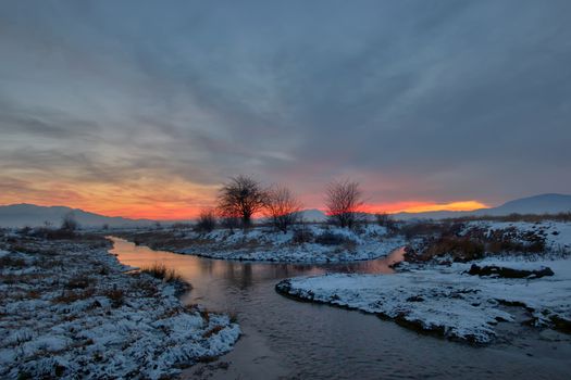 sunset with tree shadow and snow