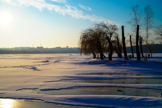 the beautiful landscape of the lake is covered with ice in the center of the city