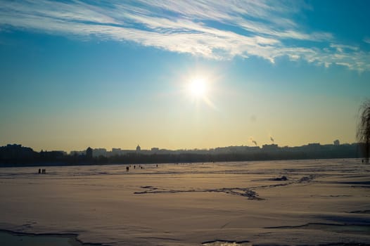 the beautiful landscape of the lake is covered with ice in the center of the city